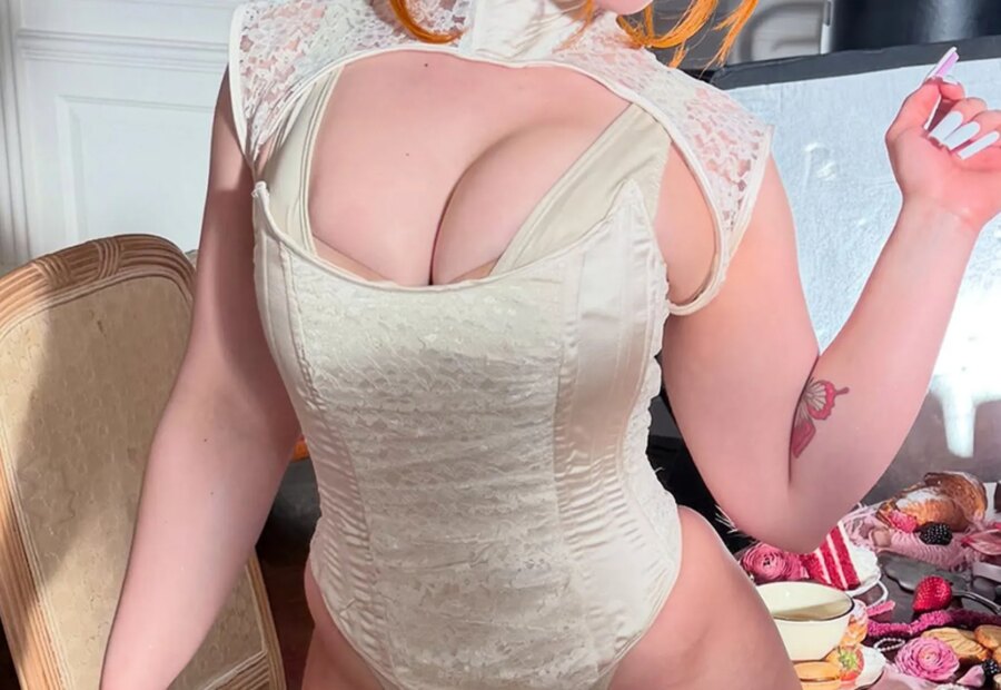 Guess the Rapper in This Corset Photo